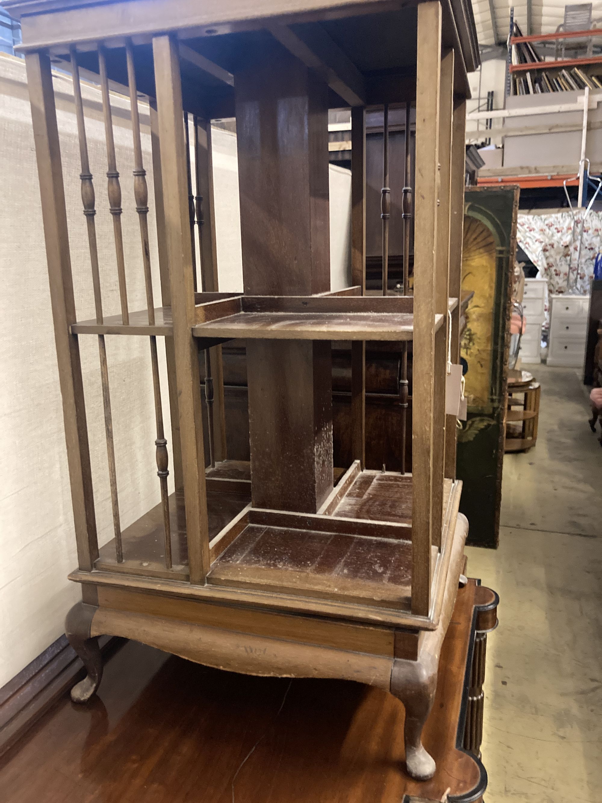 An Edwardian satinwood banded mahogany revolving bookcase, width 48cm height 89cm